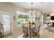 Bright breakfast nook with view of the pool and patio at 3051 Sw 41St Pl, Ocala, FL 34474