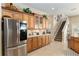 Modern kitchen with stainless steel refrigerator and wood cabinets at 3051 Sw 41St Pl, Ocala, FL 34474