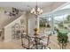 Breakfast nook with pool view and glass-top table at 3051 Sw 41St Pl, Ocala, FL 34474