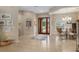 Bright and spacious entryway with tile floors and a view into the dining area at 3051 Sw 41St Pl, Ocala, FL 34474