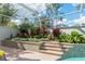 Landscaped poolside garden with tiered planters at 3051 Sw 41St Pl, Ocala, FL 34474