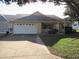 Single story home with a two car garage and mature landscaping at 9002 Sw 96Th Ln # C, Ocala, FL 34481