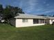 Back of house with screened patio and yard at 9002 Sw 96Th Ln # C, Ocala, FL 34481