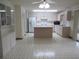 Kitchen boasts ample counter space and an island at 9002 Sw 96Th Ln # C, Ocala, FL 34481