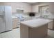 Well-equipped kitchen, featuring an island and ample cabinetry at 9002 Sw 96Th Ln # C, Ocala, FL 34481