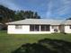 Back of house with screened patio and yard at 9002 Sw 96Th Ln # C, Ocala, FL 34481