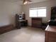 Bright bedroom with built-in desk and shelving at 9002 Sw 96Th Ln # C, Ocala, FL 34481