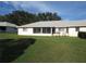 Back of house with screened patio and yard at 9002 Sw 96Th Ln # C, Ocala, FL 34481