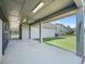 Covered horse stable with stalls and access to a grassy paddock at 10621 Sw 11Th Ter, Ocala, FL 34476