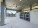 Covered horse stables with ceiling fans, providing ample ventilation at 10621 Sw 11Th Ter, Ocala, FL 34476