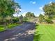 Gated entrance to expansive estate property with lush landscaping at 10621 Sw 11Th Ter, Ocala, FL 34476