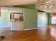 Bright living room with vaulted ceilings and laminate flooring at 10787 Sw 53Rd Cir, Ocala, FL 34476
