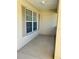 Small front porch with window and shutters at 10787 Sw 53Rd Cir, Ocala, FL 34476