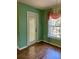 Dining area with wood flooring, window, and sliding door at 10787 Sw 53Rd Cir, Ocala, FL 34476