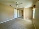 Bedroom with mirrored closet doors and ceiling fan at 10787 Sw 53Rd Cir, Ocala, FL 34476