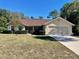 Single-story house with a two-car garage and landscaped yard at 10787 Sw 53Rd Cir, Ocala, FL 34476