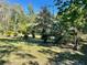 Mature trees and tropical plants in a spacious backyard at 10787 Sw 53Rd Cir, Ocala, FL 34476