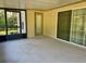 Covered porch with sliding glass doors and backyard access at 10787 Sw 53Rd Cir, Ocala, FL 34476