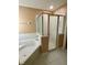 Bathroom with soaking tub and separate shower at 10787 Sw 53Rd Cir, Ocala, FL 34476