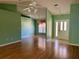 Spacious entryway with laminate flooring and a view of the living room at 10787 Sw 53Rd Cir, Ocala, FL 34476