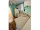 Kitchen with double sink, light wood cabinets, and refrigerator at 10787 Sw 53Rd Cir, Ocala, FL 34476