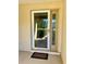Front door with storm door and welcome mat at 10787 Sw 53Rd Cir, Ocala, FL 34476