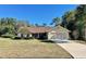 Single-story house with a two-car garage and landscaped yard at 10787 Sw 53Rd Cir, Ocala, FL 34476