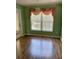 Dining area with large window and laminate wood flooring at 10787 Sw 53Rd Cir, Ocala, FL 34476