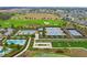 Well-maintained tennis courts surrounded by lush landscaping at 3554 Nw 55Th Cir, Ocala, FL 34482