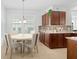 Bright breakfast nook features a round table and four chairs, perfect for morning meals at 3554 Nw 55Th Cir, Ocala, FL 34482