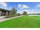 Expansive green space with a view of a pond and golf course at 3554 Nw 55Th Cir, Ocala, FL 34482