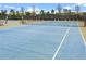 Well-maintained tennis court with new netting and surrounding fencing at 3554 Nw 55Th Cir, Ocala, FL 34482