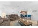 Open concept living room with a view into the kitchen and dining area at 3554 Nw 55Th Cir, Ocala, FL 34482