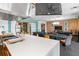 Community kitchen with an island and a view into a dining area at 3554 Nw 55Th Cir, Ocala, FL 34482
