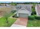 Two-story house with brick driveway and attached garage at 3554 Nw 55Th Cir, Ocala, FL 34482