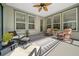 Relaxing screened porch with wicker furniture and ceiling fan at 3554 Nw 55Th Cir, Ocala, FL 34482
