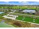 Bocce ball, shuffleboard, and tennis courts with a pond view at 3554 Nw 55Th Cir, Ocala, FL 34482