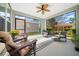Enjoy the outdoors in this screened porch with comfortable seating at 3554 Nw 55Th Cir, Ocala, FL 34482