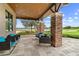 Relaxing patio seating area with wicker chairs and golf course views at 3554 Nw 55Th Cir, Ocala, FL 34482