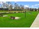 Outdoor lawn games area with cornhole and beautiful landscaping at 3554 Nw 55Th Cir, Ocala, FL 34482
