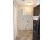 Clean laundry room with new gray cabinets and space for a washer and dryer at 3011 Nw 3Rd Ter, Ocala, FL 34475