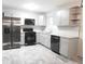 Modern kitchen with stainless steel appliances and gray cabinets at 3011 Nw 3Rd Ter, Ocala, FL 34475