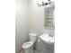 Updated bathroom with gray vanity, new toilet, and marble-tiled shower at 3011 Nw 3Rd Ter, Ocala, FL 34475