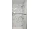 Clean shower with marble-look tile and modern fixtures at 3011 Nw 3Rd Ter, Ocala, FL 34475