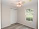 Well-lit bedroom with a large window and closet at 3011 Nw 3Rd Ter, Ocala, FL 34475