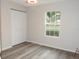 Spacious bedroom with a large window and closet at 3011 Nw 3Rd Ter, Ocala, FL 34475