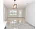 Open living room with modern gray tile flooring at 3011 Nw 3Rd Ter, Ocala, FL 34475