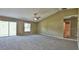 Bright main bedroom with sliding glass doors and carpeting at 13899 Sw 89Th St, Dunnellon, FL 34432