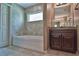 Well-appointed bathroom with a soaking tub, vanity, and tile flooring at 13899 Sw 89Th St, Dunnellon, FL 34432