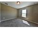 Bright and airy bedroom with neutral carpeting and large window at 13899 Sw 89Th St, Dunnellon, FL 34432